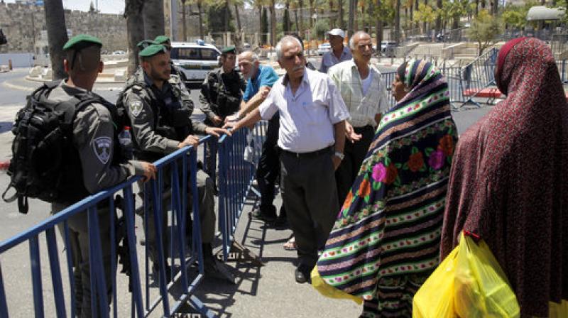 Israeli border police officers stop people from entering the Damascus Gate in Jerusalems Old City. (Photo: AP)