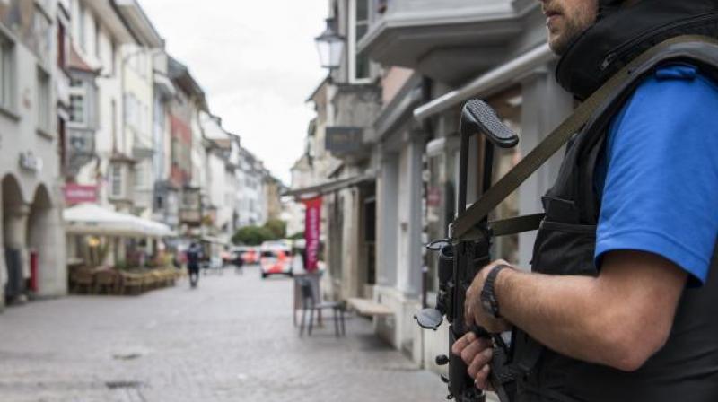 Police shut down the town of Schaffhausen in Switzerland, while they search for an unknown man who attacked people. (Photo: AP)