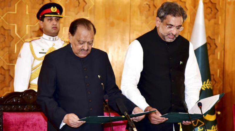 Newly-elected Prime Minister of Pakistan Shahid Khaqan Abbasi, takes oath from Pakistani President Mamnoon Hussain at the Presidential palace in Islamabad, Pakistan. (Photo: AP)