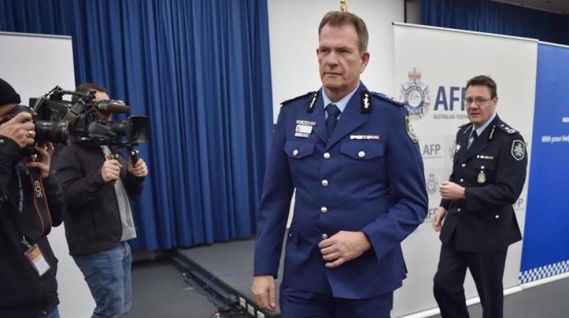 Australian Federal Police Deputy  Commissioner Michael Phelan and New South Wales Police Deputy Commissioner David Hudson leave a press conference after addressing the media in Sydney. (Photo: AFP)