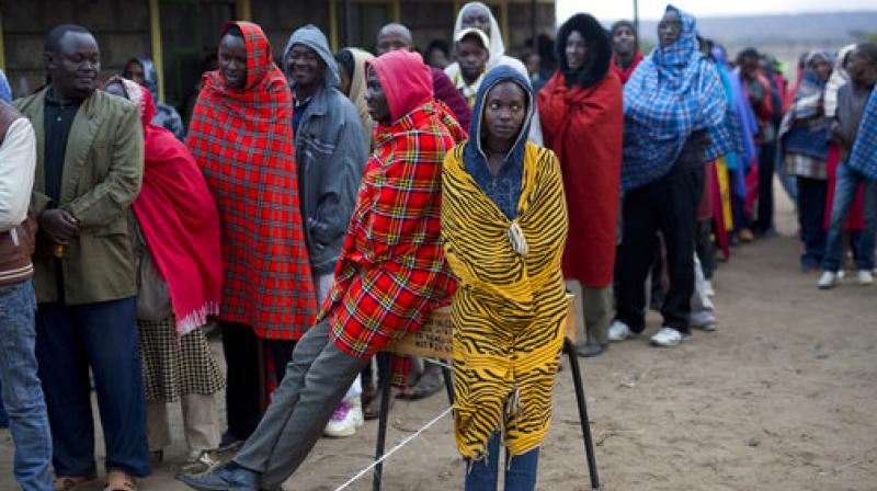 Kenyans line up to vote in Bissil, 120 kms. (75 miles) south of Nairobi, Kenya. Kenyans are going to the polls to vote in a general election after a tightly-fought presidential race between incumbent President Uhuru Kenyatta and main opposition leader Raila Odinga. (Photo: AP)