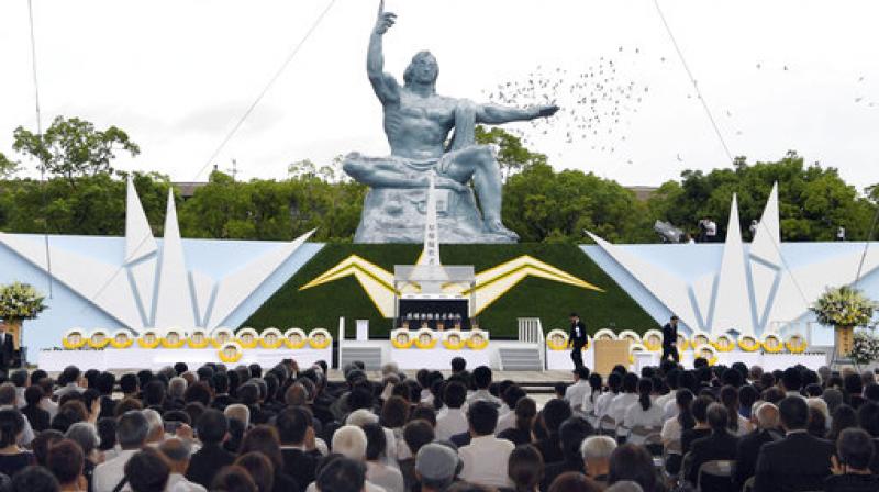 Doves fly over the Statue of Peace at Nagasaki Peace Park in Nagasaki, southern Japan during a ceremony to mark the 72nd anniversary of the worlds second atomic bomb attack over the city. (Photo: AP)