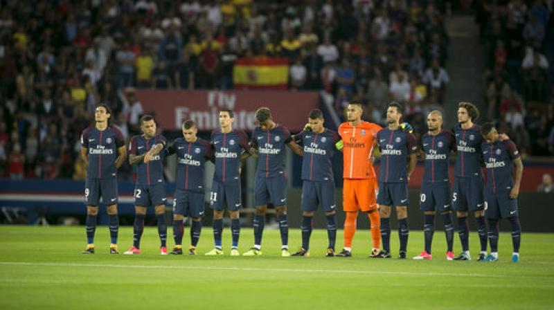 PSGs players stand for a minute of silence for the victims of the recent Spain attacks prior the French League One soccer match between PSG and Toulouse at the Parc des Princes stadium in Paris, France. (Photo: AP)