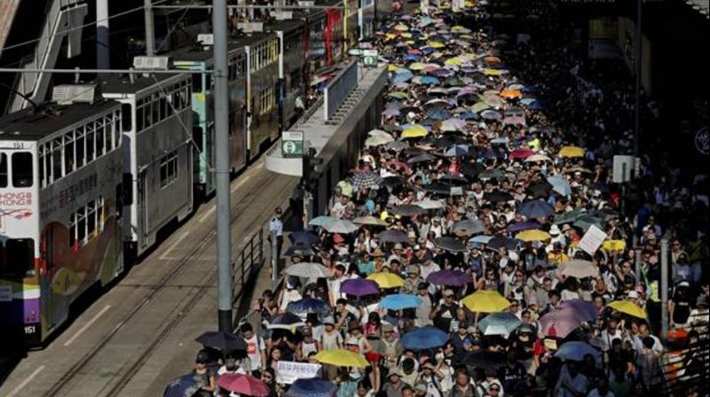 Thousands raise umbrellas during a rally to support young activists Joshua Wong, Nathan Law and Alex Chow in downtown Hong Kong on August 20, 2017. (Photo: AP)