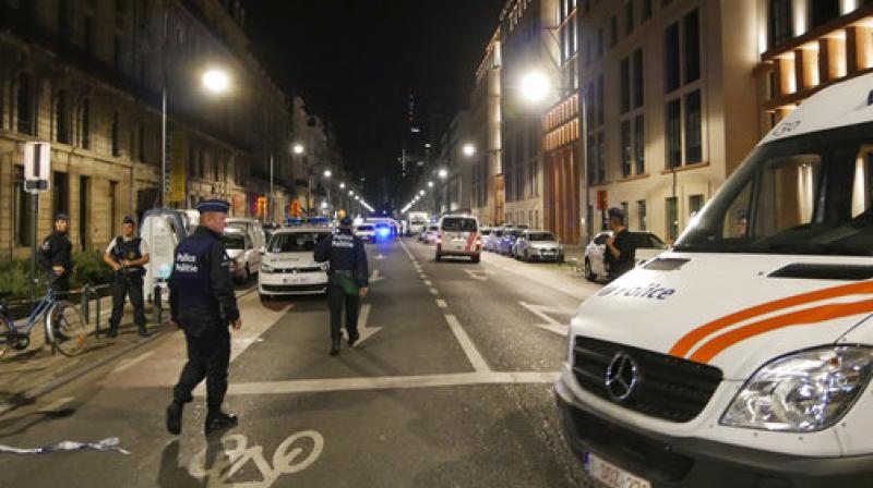 Police secure the scene in downtown Brussels after a reported attack on Belgian Army soldiers on Friday. (Photo: AP)