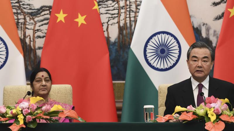 Foreign Minister Sushma Swaraj and Chinese Foreign Minister Wang Yi attend a press conference after their meeting at the Diaoyutai State Guest House in Beijing. (Photo: AP)