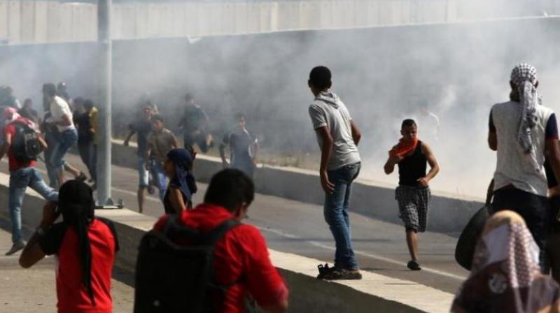 Dozens of Palestinian demonstrators broke into the Gaza side of the terminal on Friday, setting a pipeline that delivers gas from Israel alight and torching a goods conveyor belt. (Photo: AFP)