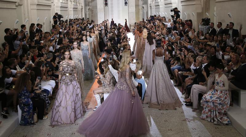 Models wear creations for Elie Saab Haute Couture Fall-Winter 2018/2019 fashion collection presented Wednesday, July 4, 2018 in Paris. (Photo: AP)
