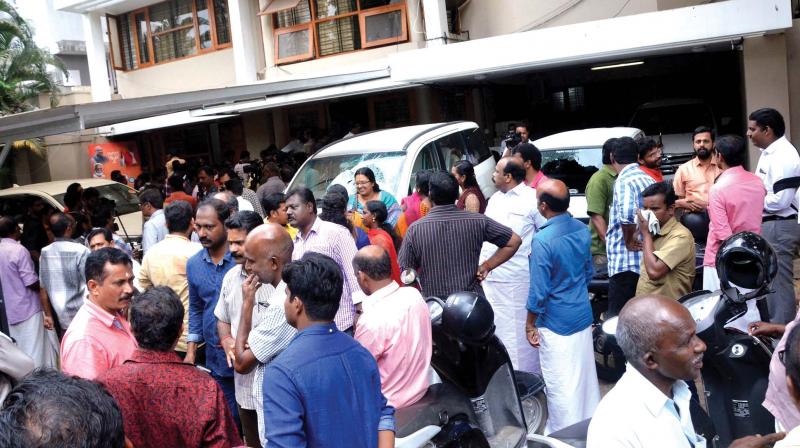 Crowd gathered in front of the BJP state headquarters in Thiruvananthapuram on Friday morning. 	 DC