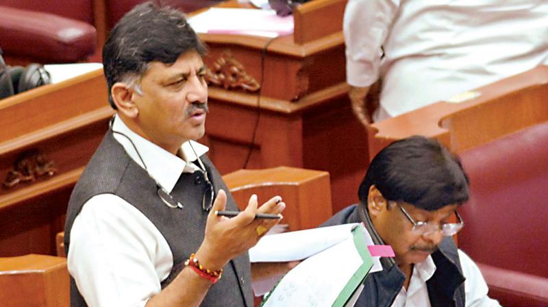 Energy Minister D.K. Shivakumar speaks in the Legislative Council during the winter session in Belagavi on Tuesday. PWD Minister Dr. H.C. Mahadevappa is also seen. (Photo: DC)