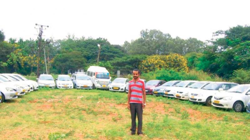 The accused Chetan Kumar with the 23 stolen cars  (Image DC)