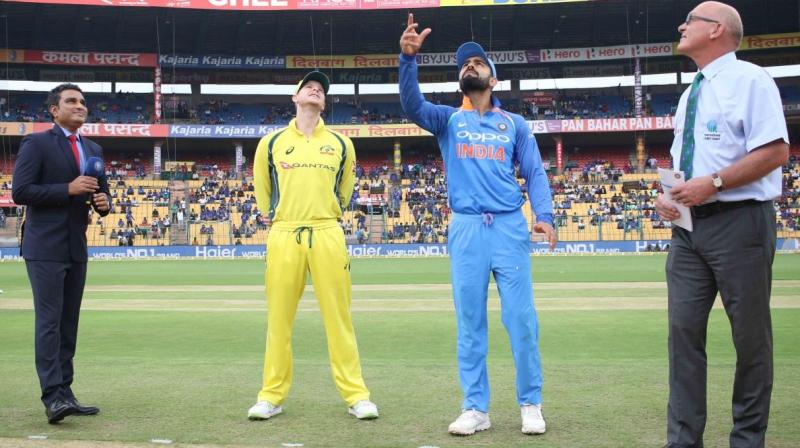 The coin slipped from Kohlis fingers and instead of going up in the air, it landed flat on the ground, causing the Australia skipper and anchor Sanjay Manjrekar to burst into laughter.  (Photo: BCCI)