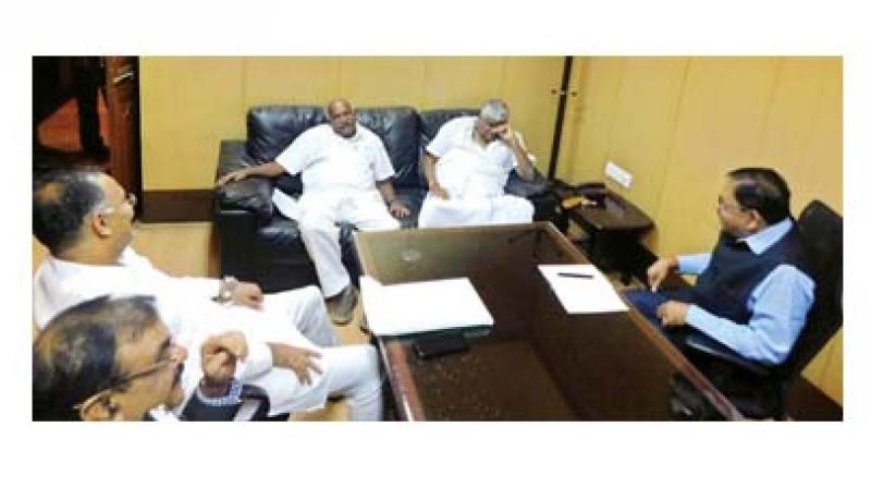 KPCC president Dinesh Gundurao (from L), JD(S) state president H. Vishwanath, PWD minister H.D. Revanna and deputy chief minister Dr G. Parameshwar at a meeting to discuss seat-sharing for Lok Sabha polls, in Bengaluru on Monday. (Photo: KPN)