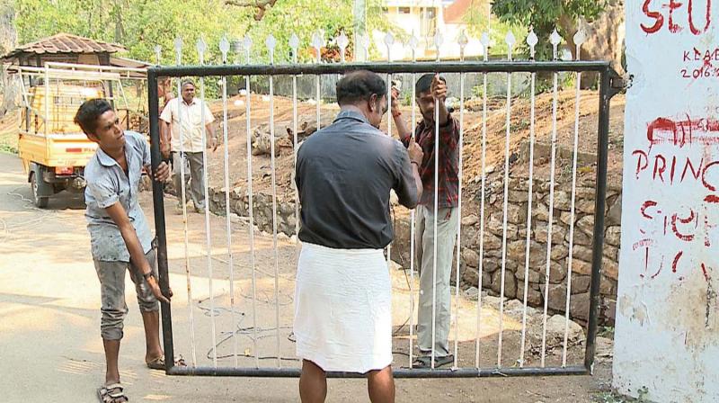 The Law Academy gate being removed at  Peroorkada.