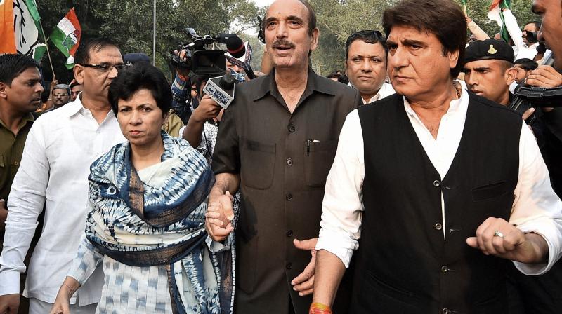 Congress leaders Ghulam Nabi Azad, Raj Babbar and Kumari Shelja at Mandir Marg Police Station where party Vice President Rahul Gandhi was detained by the police in New Delhi. (Photo: PTI)