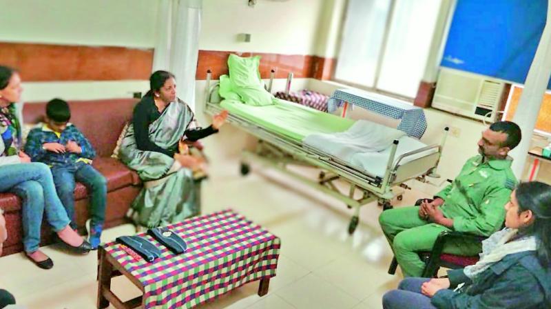 Defence minister Nirmala Sitharaman meets Wing Commander Abhinandan Varthaman at Armys RR Hospital in Delhi on Saturday. Abhinandans wife (left) Sqn Ldr Tanvi Marwah (retd), seven-year-old son Tavish and sister Aditi (right) are also seen.