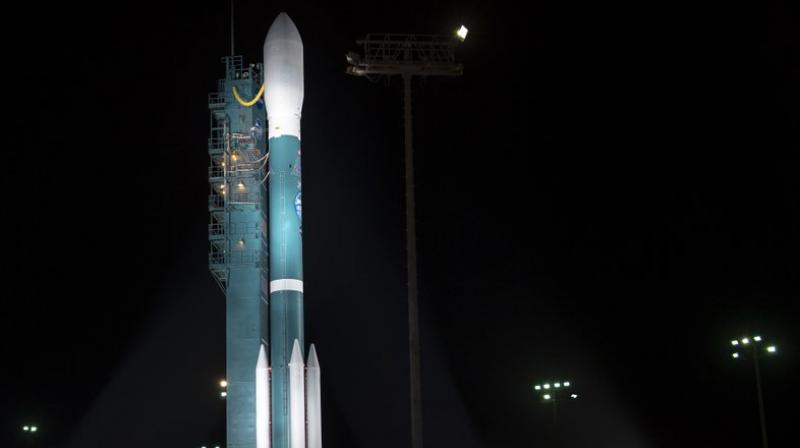 The United Launch Alliance (ULA) Delta II rocket with the NASA Ice, Cloud and land Elevation Satellite-2 (ICESat-2) onboard is seen shortly after the mobile service tower at SLC-2 was rolled back at Vandenberg Air Force Base, Calif. The ICESat-2 mission will measure the changing height of Earths ice. (Bill Ingalls/NASA via AP)