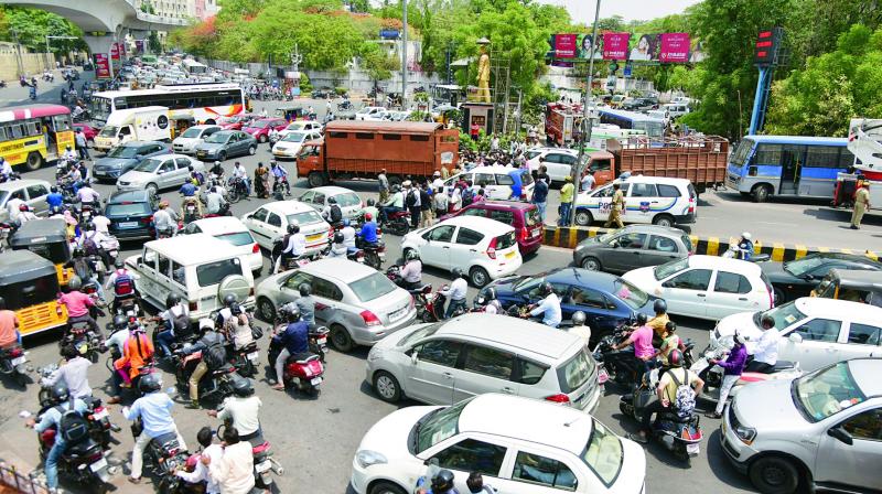 Traffic jam at the Khairatabad junction due to the protest by the former home guards and their family members, on Monday.  (Photo:DC)
