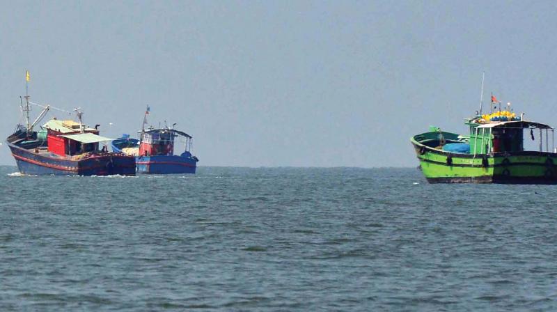 Fishing boats from Thoppumpady harbour leave for search operations on Tuesday. (Photo: DC)