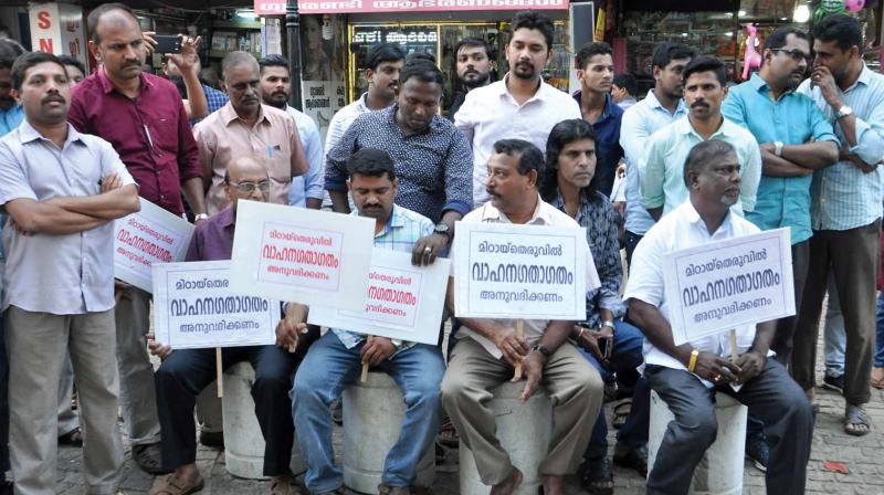 Merchants participate in a protest meet organised in front of SM Street on Tuesday.	DC