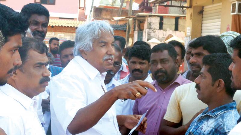 District collector U.V. Jose shows the wall relief work at the entrance of SM Street to Chief Minister Pinarayi Vijayan just before the inaugural function of the renovated heritage street on Saturday. Mayor Thottathil Raveendran, A. Pradeep Kumar, MLA,  and Labour Minister T.P. Ramakrishnan look on. 	(Photo: Venugopal)