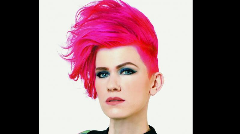 File picture of a model sporting pink flamingo hair colour used for representational purposes only