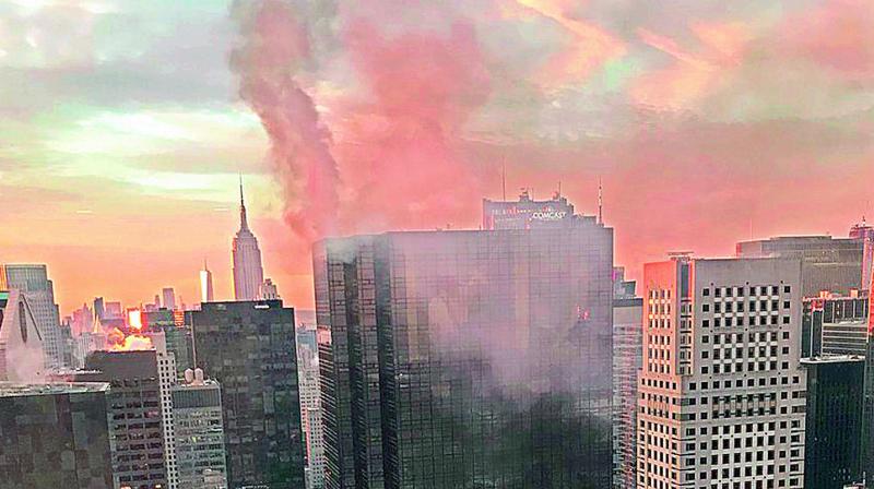 Smoke rises from Trump Tower in New York. (Photo:AP)