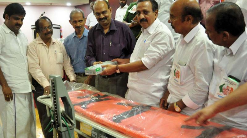 M.K.Raghavan, MP, hands over medical equipment donated by K.Karunakaran Charitable Trust to Institute of Maternal and Child Health superintendent Dr C.S. Sajith Kumar in Kozhikode on Thursday.   (Photo:  Venugopal)
