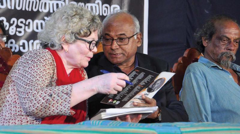 Prof. Kancha Ilaiah, vehement critic of Hindu supremacist ideology, interacts with writer Sarah Joseph at a book release function in Kozhikode on Saturday.