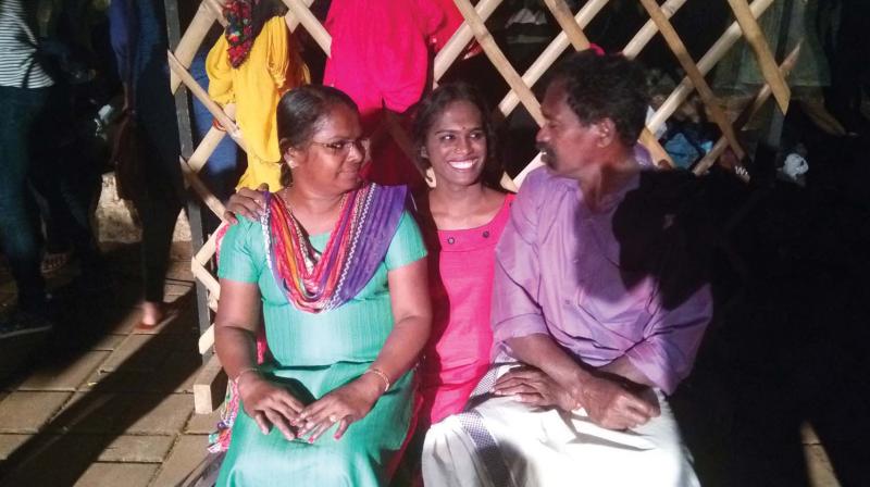 Daya Gayathri with her parents after the play was performed at ITFoK on Saturday night.
