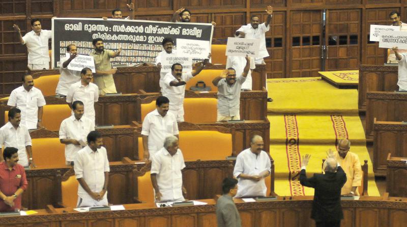 Governor P. Sathasivam pacifies Opposition MLAs who raised protest against governments handling of Ockhi disaster. 	(Photo: A.V. MUZAFAR)