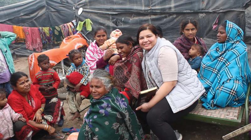 Ruhpreet (in white jacket) with the  women and children in Patiala.