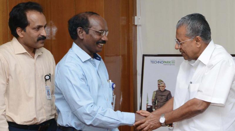 Indian Space Research Organisation chairman Dr. K. Sivan being greeted by Chief Minister Pinarayi Vijayan on his arrival at CMs office in Secretariat in Thiruvananthapuram on Saturday. Mr Sivan handed over to the Chief Minister a cheque of 16.68 lakh towards the Ockhi fund. Also seen is Vikram Sarabhai Space Centre director S. Somanath. (Photo: DC)