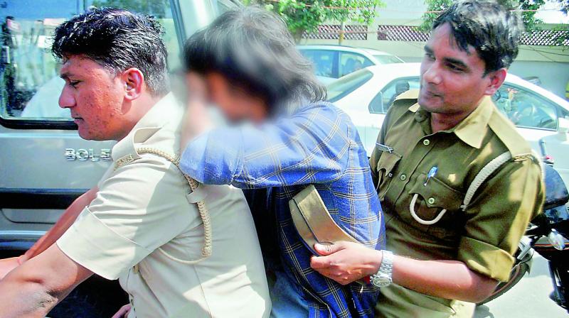 The Anti-Romeo squad of UP police detains a youth in Lucknow on Wednesday. (Photo: PTI)