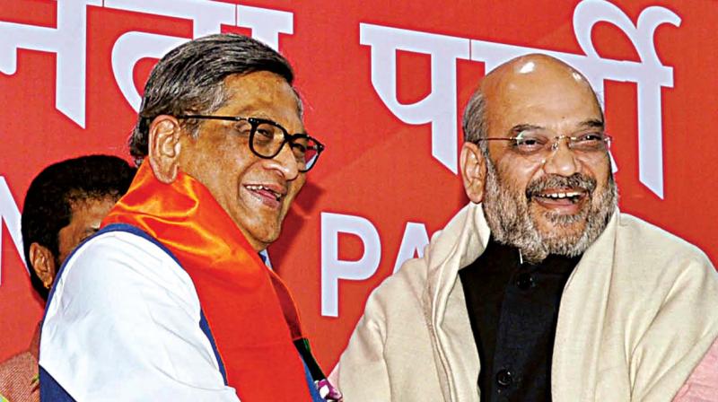 BJP national president Amit Shah welcomes former Karnataka CM S.M. Krishna who joined the saffron party in New Delhi on Wednesday.