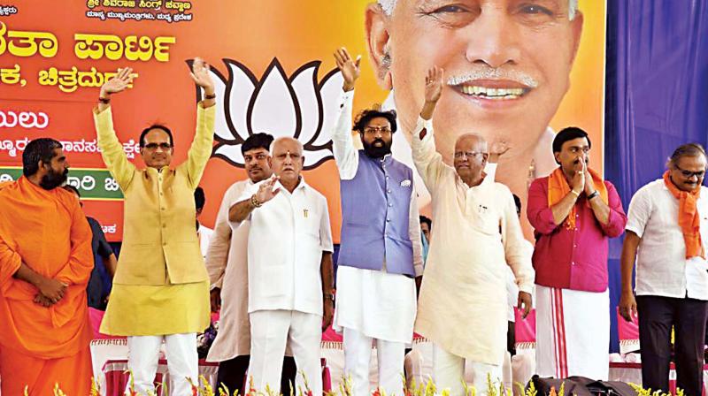 A file photo of former BJP minister Janardhan Reddy with partys candidate Sriramulu at a rally in Molakalmuru