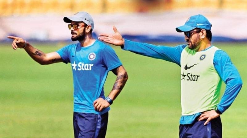 Kohli believes that we may now see the aggressive side of Dhoni, that we saw during the early stages of his career, once again, now that the 35-year-old does not have the burden of leading the side. (Photo: PTI)