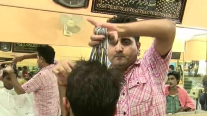 The barber charges close to Rs 100 for a 20 minute haircut (Photo: YouTube)
