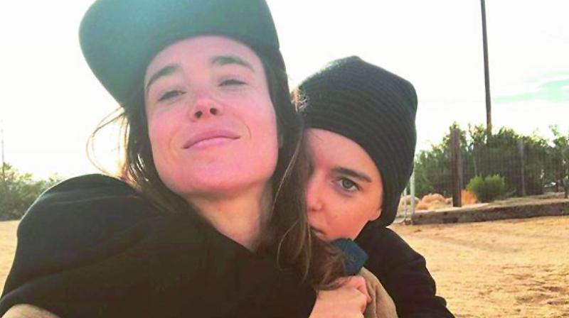 Emma Portner hugs her wife Ellen Page. (Photo: DC)