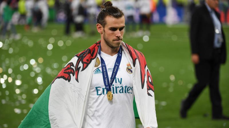 Bale  has four Champions League winners medal from five seasons in Spain, equalling the British record of former Liverpool defender Phil Neal.. (Photo: AFP)