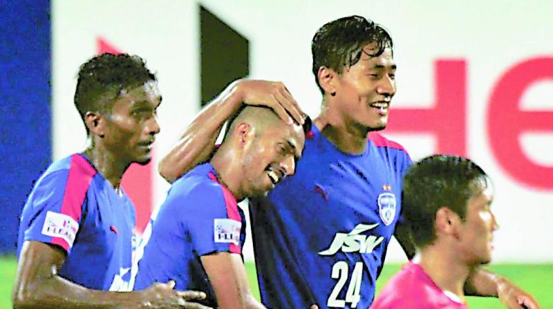 Bengaluru FCs Mandar Rao Desai celebrates his goal with teammates.(Photo: R. Samuel)