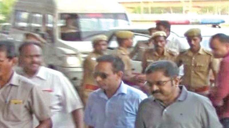 EC bribery case accused TTV Dhinakaran, leader of the AIADMK (Amma), carries his bag in Chennai airport, as he is being taken back to Delhi by flight by police on Saturday.
