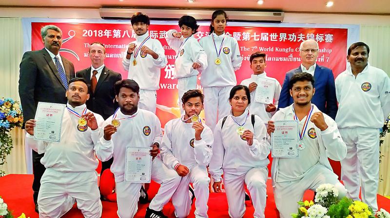 Kung fu practitioners from across the country among which five are from Telangana pose with their medals.