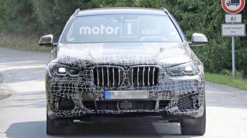The latest images of a heavily camouflaged test mule from Germany give us a better glimpse of the upcoming coupe-SUV.