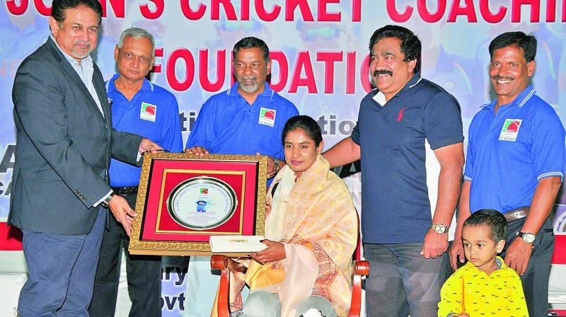 Former HCA president Arshad Ayub (from left), Jyothi Prasad, St Johns Cricket Academy founder John Manoj and V. Chamundeshwaranath felicitating Mithali Raj at the St Johns Cricket Academy in Hyderabad on Saturday. (Photo: P. Surendra)