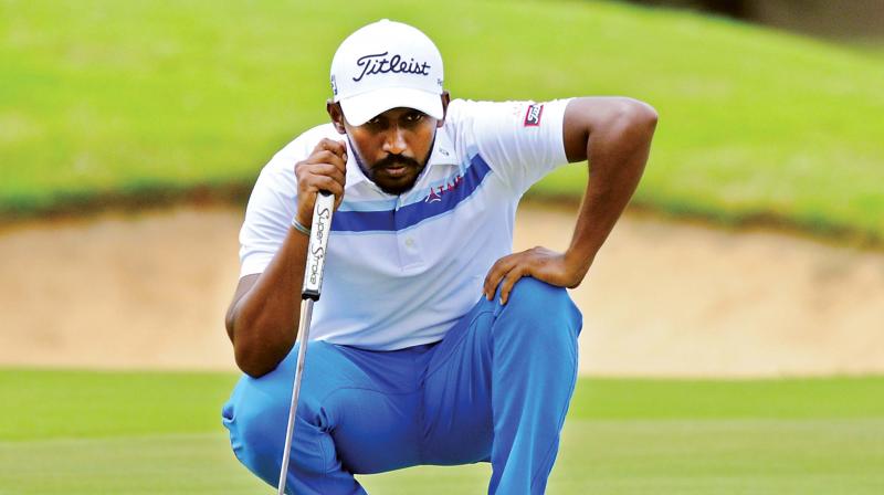 S Chikkarangappa lines up a putt during the third round at the KGA, on Saturday.(Photo: R. SAMUEL)