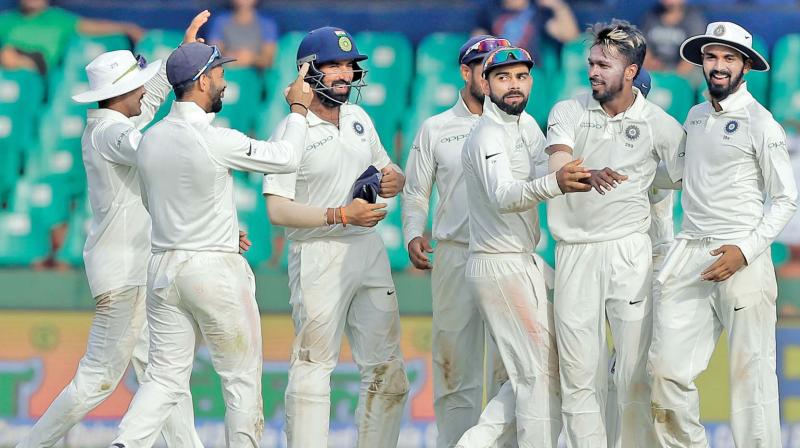The Indian team celebrates a wicket. (Photo: AP)