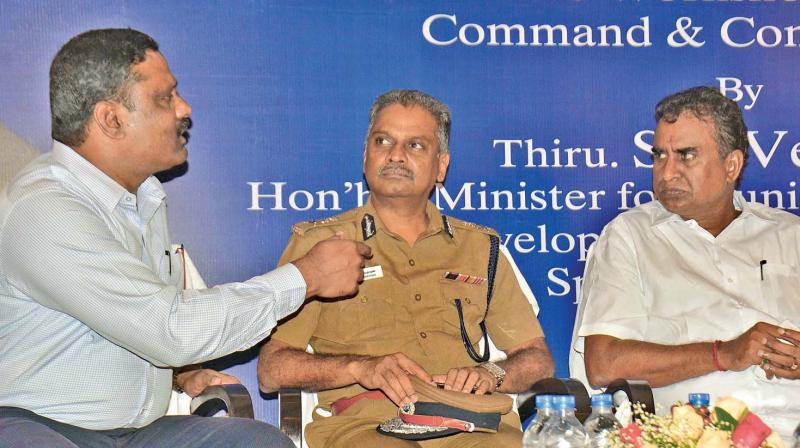 Corporation commissioner D. Karthikeyan interacts with the minister S. P. Velumani and police commissioner A.K. Viswanathan during the inauguration of a workshop on Command and Control Centre on Monday.(Photo: DC)