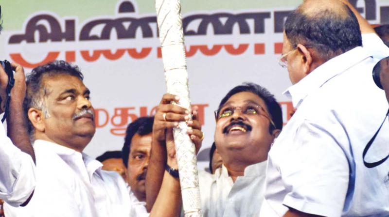 TTV supporters present him a silver sceptre at the Melur rally. (Photo: DC)
