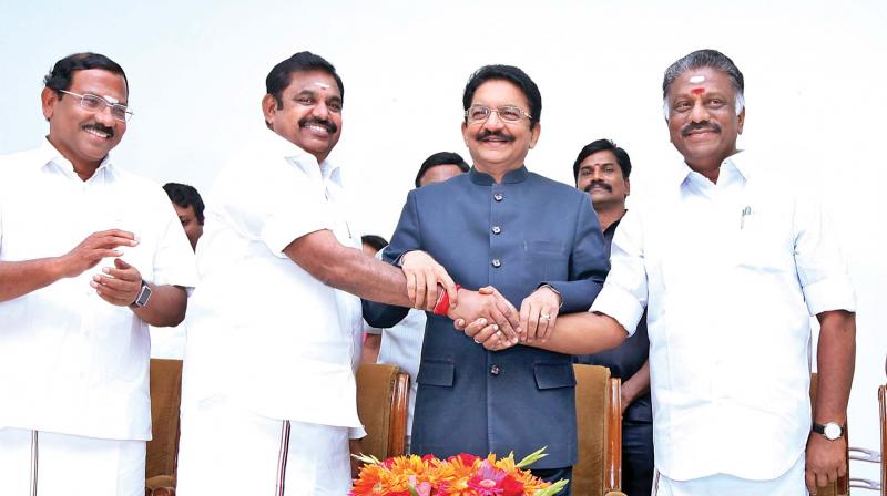 Chief Minister K. Palaniswami greets O. Panneerselvam after he was sworn-in as Deputy Chief Minister in the presence of Governor CH Vidyasagar Rao at Raj Bhavan in Chennai on Monday. Photo: DC)